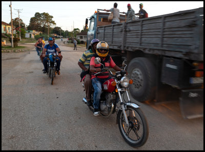 Transportation of workers with bicycle, MC and truck....