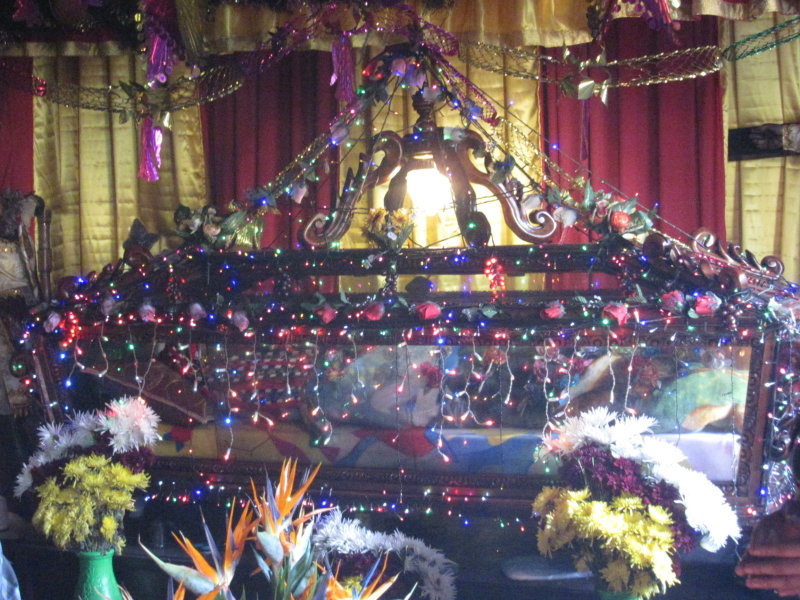 A model of Jesus in a coffin is also beside Maximon