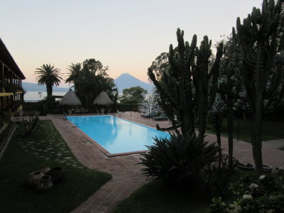 Our hotel pool, in the early morning, looking towards a volcano