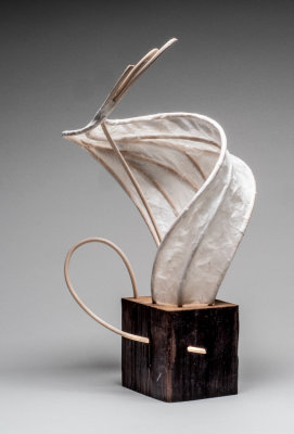 Reed, paper and wood lantern.