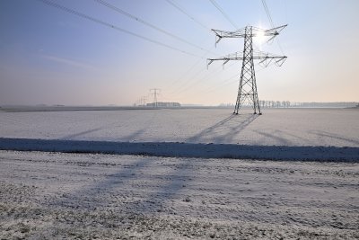 High voltage towers in the snow