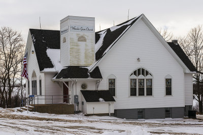It doesn't matter how cold the winter, a country church represents a warm welcoming for the community it serves. It is good to this one in good shape. As the size of farms increase less farmhouses saturate countryside leading to less people to support countryside and small town churches.

An image may be purchased at http://edward-peterson.pixels.com/featured/wheeler-grove-church-in-winter-edward-peterson.html?newartwork=true