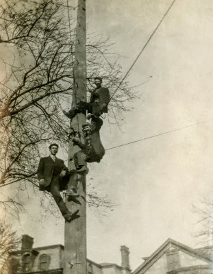 Three Men up a Pole