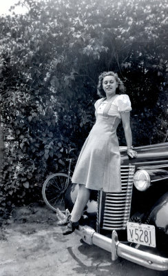 Lady posing on a Car  