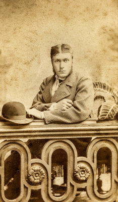 Seated Gentleman Holding a Bowler Hat  