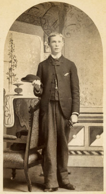Young Man Holding a Small Hat  
