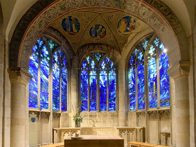 Gloucester Cathedral - Rhapsody in Blue. The centre window shows St Thomas kneeling before Jesus, who has risen from the dead. T