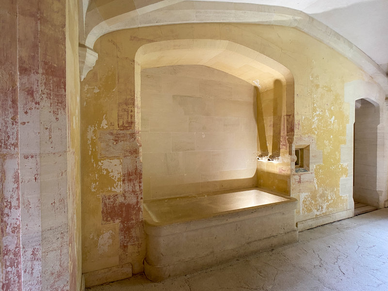 Woodchester Mansion - the bath is carved a solid limestone block. The bath is also a shower cubicle.