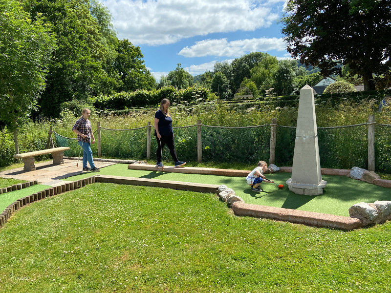 Symonds Yat Butterfly Zoo - A round of crazy golf - Ella, Neeka and Reuben looking for the ball?