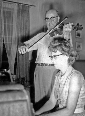 1958 - 1959 Alice on piano, Uncle Orville on Violin at Mulungwishi.jpg