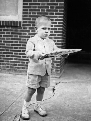 1958 - 1959 Greg holding wrapped present.jpg