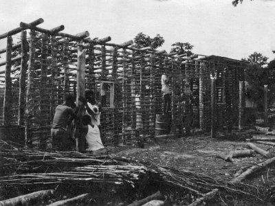 1954 - 1957 Building construction using poles.jpg