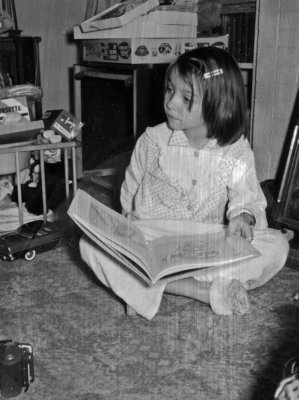 1954 - 1957 Chistmas 1957 - Susie looking at book.jpg