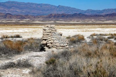 dry lake and wall ruins