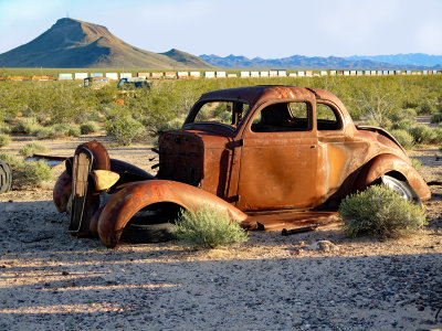 Rusty car in sunbeam