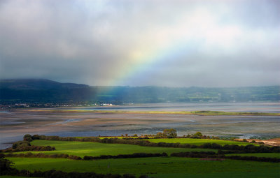 rainbow over the green grass of  Ireland