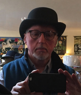 In a bowler hat
