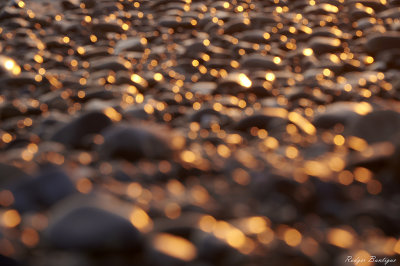 Out of focus rocks with golden light