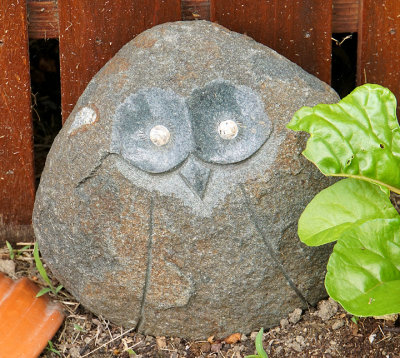 Stone owl sculpture.