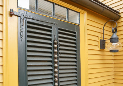 Louvered door with bells.
