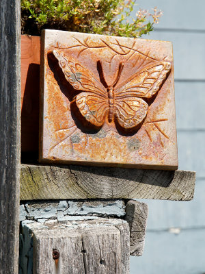 Butterfly plaque on post.