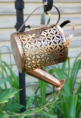 Copper watering can.