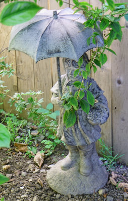 Umbrella figure sculpture.