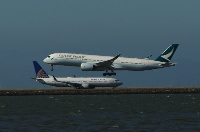 San Francisco, CA UAL 737 Holds For Cathay Pacific 7-15-18 544 PM #1.jpg