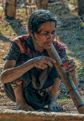 Smoking a Bamboo Pipe