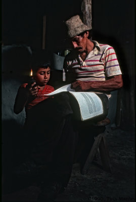 Manuel and Victor Reading by Candlelight