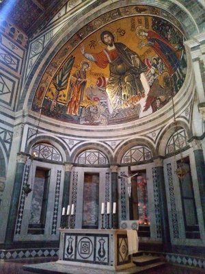 The apse is decorated by a 1297 mosaic depicting St. Miniato to the right of Christ holding a crown