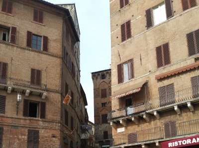 Siena Banners flying around the square for the most recent winning contrada in the Palio horse race