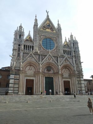Siena Duomo 1215-Adorned with patriarchs and prophets, studded with roaring gargoyles, and topped with prickly pinnacles
