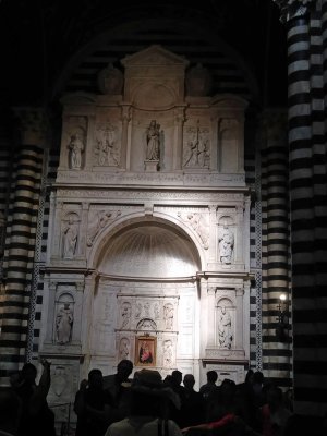 Piccolomini Altar built 1481-1485 by Andrea Bregno in Carrara marble with Michelangelo's St. Paul in the lower right corner 