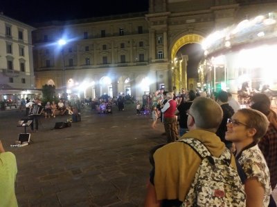 Piazza della Repubblica at night with performer