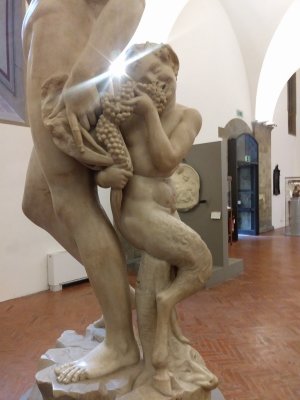 Impish Satyr at Bacchus' feet