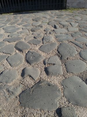 Actual large basalt stones of the Via Sacra- main street of ancient Rome. Possibly walked on by Caesar Augustus 2,000 years ago!