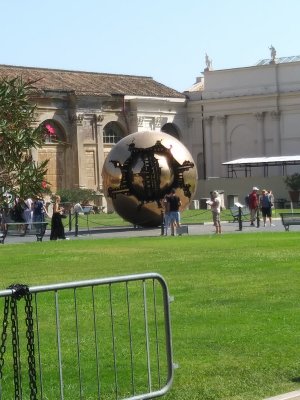 1990 Bronze Ball or Sphere Within Sphere by Pomodoro who says that the inner ball = the Earth and outer ball = Christianity.