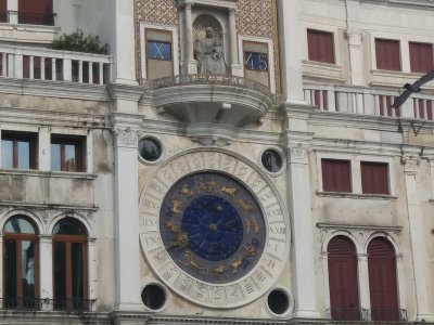 Clock Tower-Dial shows 24 hours, signs of zodiac & phases of the moon. Above the dial is the world's first digital clock 