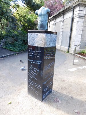 The Oscar Wilde Sculpture- a pillar with a bronze male torso representing Dionysus, the God of wine, youth and theatre