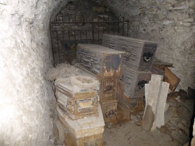 Vault with multiple coffins containing mummies