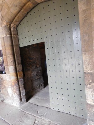 Metal door covering second arch in castle entrance