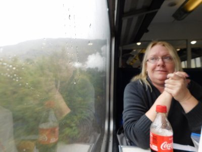 Tammy on the Hogwarts Express steaming through mysteriously misty lochs and the green hills of the Scottish Highlands