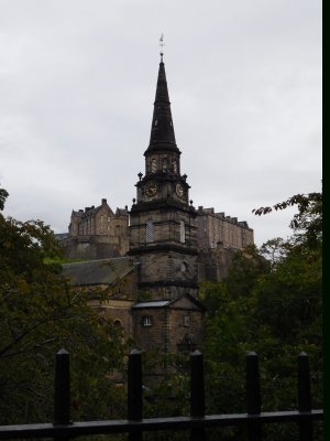 The Parish Church of St Cuthbert's spire with Edinburgh Castle in the back ground