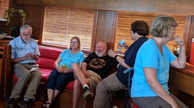 Back on the boat, Bill, Mary T, Lou, Mary L and Jan relax before lunch.