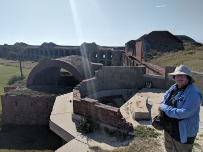 Mary, with the fort magazine, walls and yard in the background