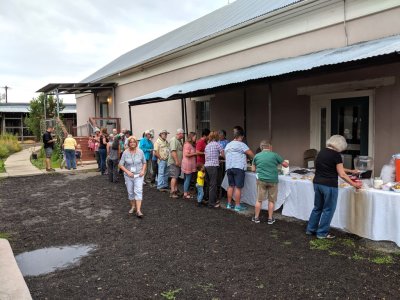 It rained briefly, but the food line was under an awning and the picnic tables were under the covered pavilion, so the food line kept moving.