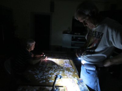 Jackie and Steve still working on a puzzle after the lights go out, Sep 20, 2015