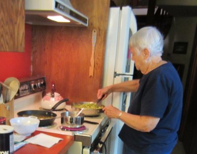Jackie cooking okra at Steve and Mary's, Sep 22, 2015