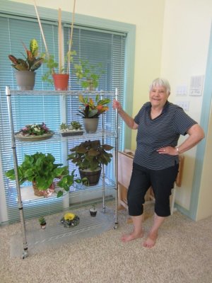 Jackie showing the plants she helped Mary groom, Sep 23, 2015